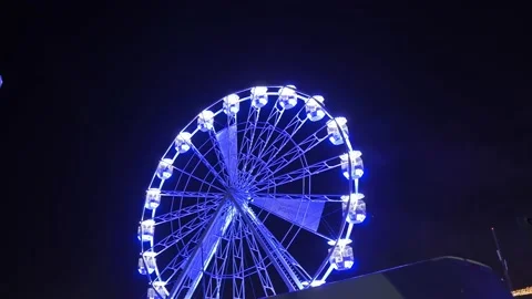 Illuminated Ferris Wheel rotating at Night, black isolated background Stock-Footage 209646534
