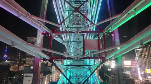 Illuminated Ferris Wheel Structure at Night Stock Footage 313838094