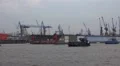 Illuminated ferry tug boats and docks in the Hamburg harbour HD Footage