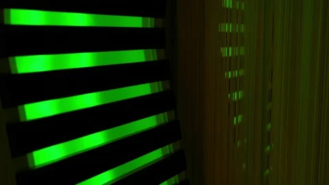 Illuminated Green Column with Stripes Stockbeeldmateriaal 221261749