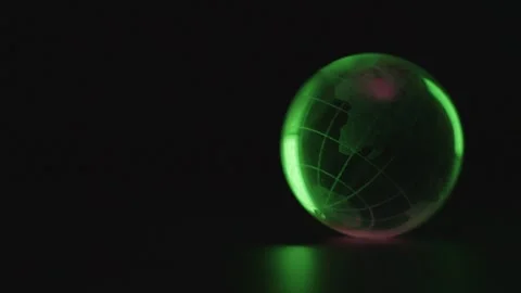 Illuminated Green Globe in Dark Setting Stock Footage 277115587