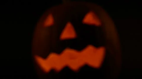 Illuminated halloween pumpkin blurred to sharp Stock Footage 69008928