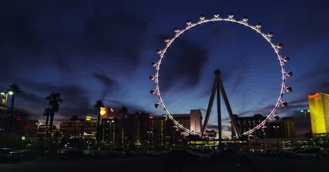 The illuminated High Roller Ferris Wheel in full LED illumination in Time Lapse Video stock 62677905