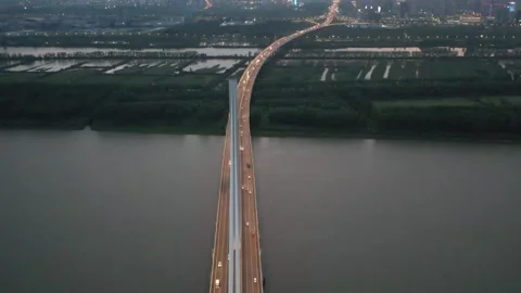 Illuminated Highway Extending Across River At Blue Hour Stock Footage 344039842