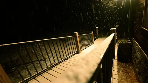 Illuminated house during snowfall Stock Footage 299807644