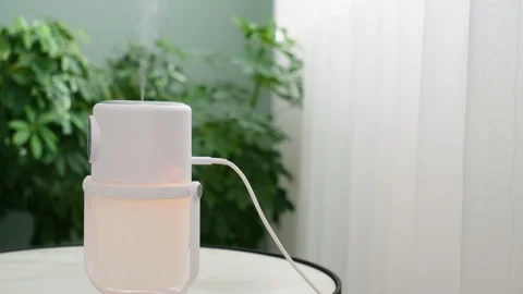 An illuminated humidifier on the table in the room Stock Footage 301706030