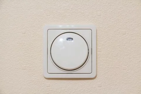 Illuminated ivory light switch Stock Photos