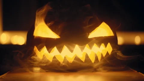 Illuminated Jack-o-Lantern With Smoke on Halloween Night Stock Footage 277246442