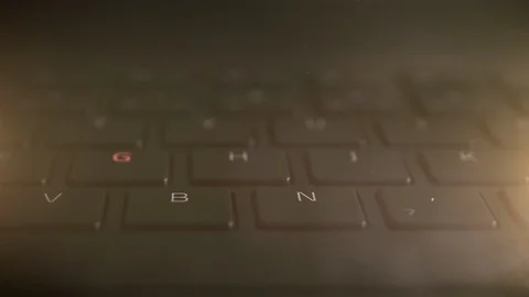 Illuminated keyboard buttons letters in multiple RGB colors on modern Stock Footage 121288002