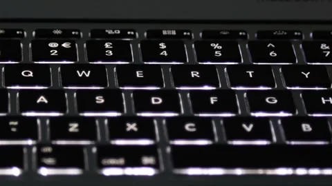 Illuminated Laptop Computer Keyboard with key led lights turning on and off Stock Footage 241515214