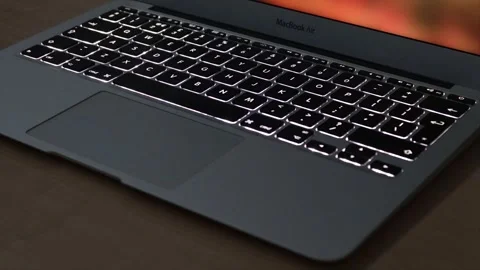 Illuminated Laptop Computer Keyboard with key led lights turning on and off Stock Footage 242024612