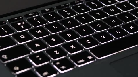 Illuminated Laptop Computer Keyboard with key led lights turning on and off Stock Footage 242024917