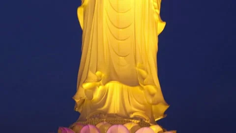 Illuminated large statue of Lady Buddha, statue of the goddess of mercy Stock Footage 310178436