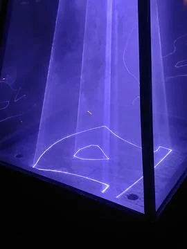 Illuminated Laser Pyramids in Park During Night Light Festival 库存照片