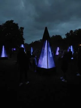 Illuminated Laser Pyramids in Park During Night Light Festival Stock Photos