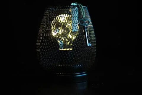 Illuminated Light Bulb with Key inside Decorative Wire Mesh Lamp Stock Photos
