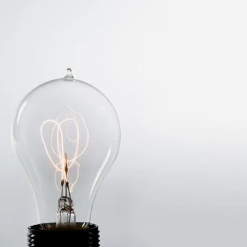 An illuminated lightbulb Stock Photos