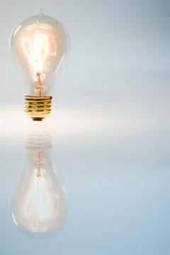 An illuminated lightbulb Stock Photos
