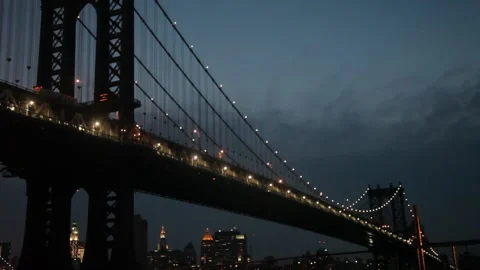 Illuminated Manhattan Bridge at Dusk with Subway Train Stock Footage 341323928