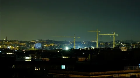 Illuminated Mechanical cranes working on night skyline in rome italy timelapse Stock Footage 111196355