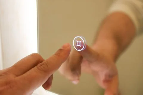 Illuminated mirror with touch control button Fotos de archivo