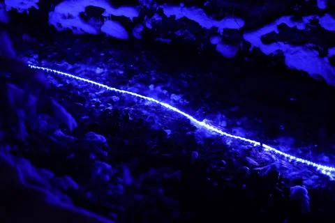 Illuminated mountain stream Stock Photos