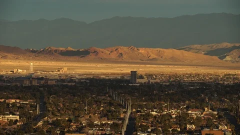Illuminated mountains at sunset behind Las Vegas neighborhood Stock Footage 107719009