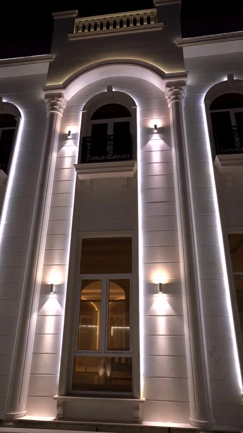 Illuminated Neoclassical Building Facade at Night Stock Footage 336853556