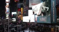 Illuminated Night Business Pedestrians Walk Passing Times Square New York City HD Footage
