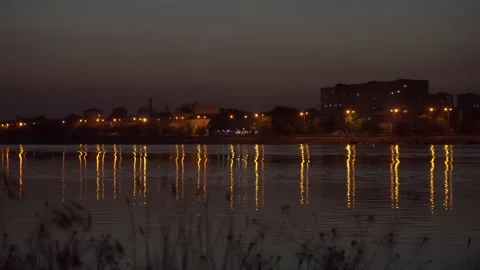 Illuminated Night Canal with Reflections on Water 스톡 동영상 343894530