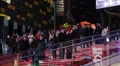 Illuminated Night Crowd of People Busy New York City Nasdaq Stock Exchange Board HD Footage