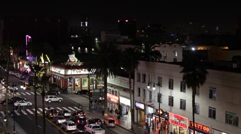 Illuminated Night Rush Hour Traffic Hollywood Boulevard People Crossing Cars USA Video stock 32305318