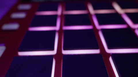 Illuminated Pads Of MIDI Drum Machine Controller In Music Studio Close Up Video stock 329971167