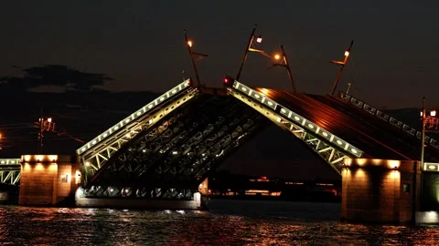 Illuminated Palace Drawbridge rises over Neva river at night. Stock Footage 340898074