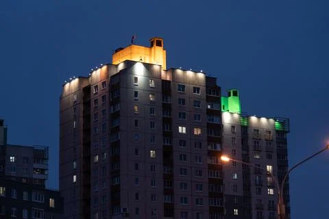 Illuminated panel, multi-storey buildings in the distance. An evening in Mins Stock Photos
