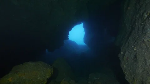 Illuminated portion of sea seen from inside a cave,Ustica, Mediterranean sea Stock Footage 125106066