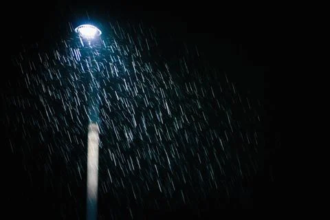Illuminated rain drops Stock Photos
