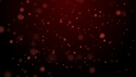 Illuminated red and blurred sparcles falling and flying on the dark red textured Stock Footage 101210344