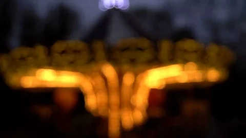 Illuminated retro carousel at night. Blurred Stock Footage 69227158