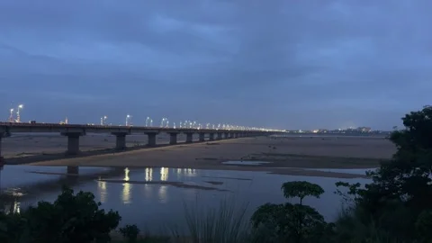 Illuminated River Bridge at Blue Hour with Water Reflections Video stock 340499106
