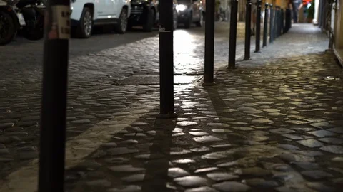 Illuminated road with car headlights at night. italian crowded streets Stock Footage 123082653