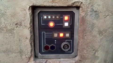 Illuminated Sci Fi Control Panel with Red and White Lights in Concrete Wall Stock-Footage 346984834