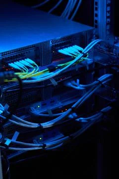 Illuminated Server Rack with Vibrant Network Cables 写真素材