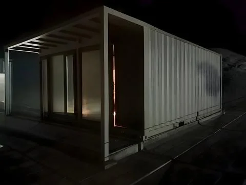 Illuminated shipping container structure with open design Stock Photos