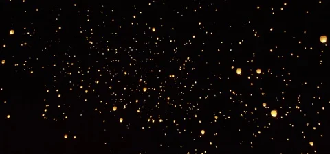 Illuminated sky lanterns floating towards the sky at night 動画素材 73551555