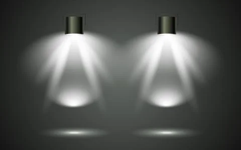 Illuminated spotlights creating a dramatic light display on a dark stage Illustrazione stock