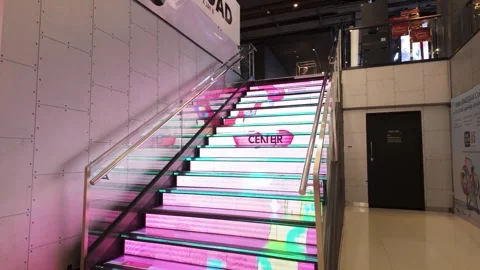 Illuminated staircase featuring  LED displays on each step Stock Footage 339306684