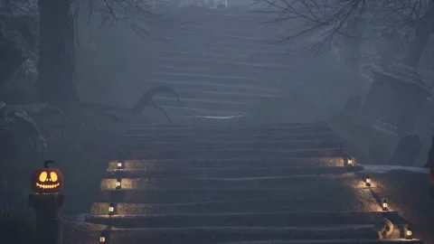 A illuminated staircase with lanterns and pumpkins at midnight Stock Footage 210378928