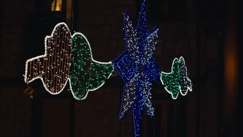  Illuminated String Lights Featuring Decorative Garland Shapes at Night Stock Footage 291799768