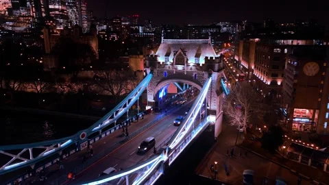 Illuminated structural landmarks, visitor silhouettes, bridge traffic Stock Footage 309258888